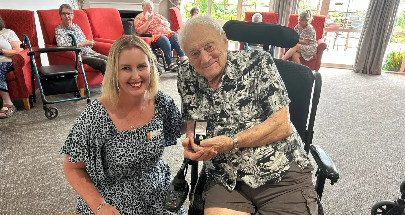 Service badge presented to centenarian resident